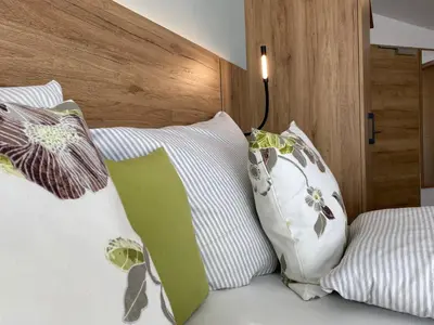 Ein Bett oder Betten in einem Zimmer der Unterkunft OlfenLodge
