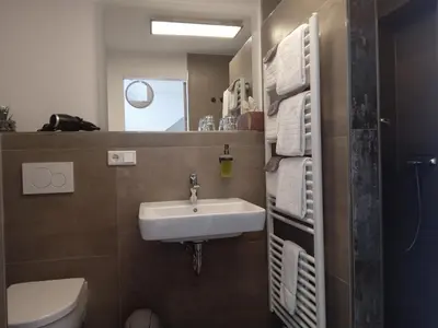 Ein Badezimmer in der Unterkunft OlfenLodge