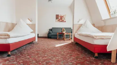 Ein Bett oder Betten in einem Zimmer der Unterkunft Avantgarde Hotel