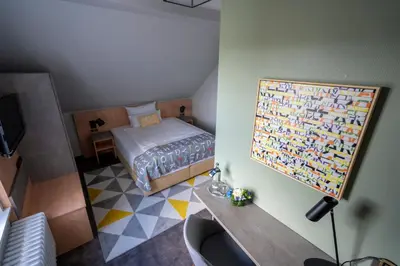 Ein Bett oder Betten in einem Zimmer der Unterkunft Hotel Stadt Lüdenscheid