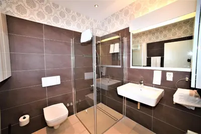 Ein Badezimmer in der Unterkunft Ascot Hotel