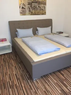 Ein Bett oder Betten in einem Zimmer der Unterkunft Hotel Aleo