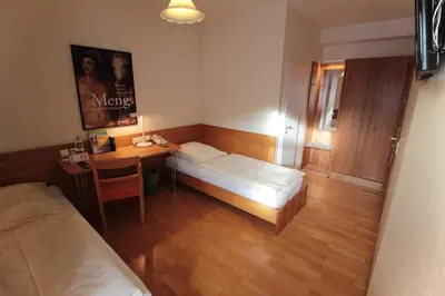 Ein Bett oder Betten in einem Zimmer der Unterkunft An der Persiluhr Stadt-gut-Hotel