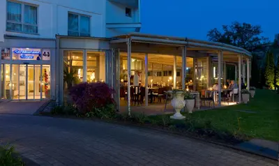 Ein Restaurant oder anderes Speiselokal in der Unterkunft Ringhotel Am Stadtpark