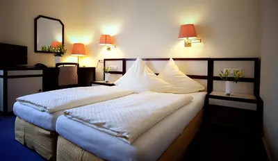 Ein Bett oder Betten in einem Zimmer der Unterkunft Hotel Haus Union