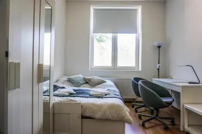 Ein Bett oder Betten in einem Zimmer der Unterkunft Vorhalle Apartment