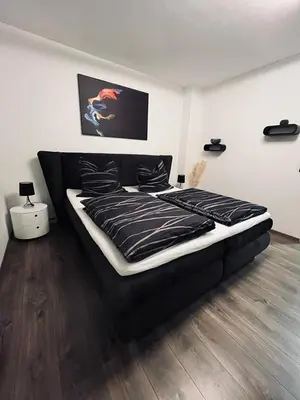Ein Bett oder Betten in einem Zimmer der Unterkunft Casa Arturo Düsseldorf