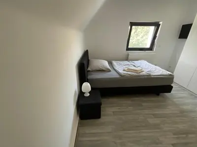 Ein Bett oder Betten in einem Zimmer der Unterkunft Warzalas Apartement