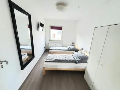 Ein Bett oder Betten in einem Zimmer der Unterkunft Pottmensch Oberhausen