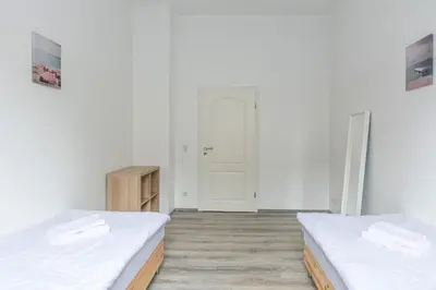 Ein Bett oder Betten in einem Zimmer der Unterkunft T&K Apartments - 2 Room Apartment - Ground Floor
