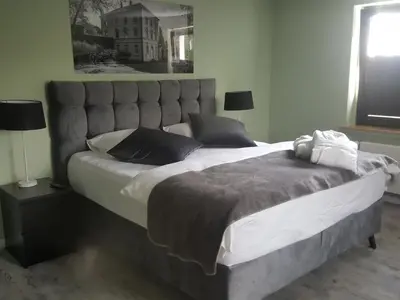 Ein Bett oder Betten in einem Zimmer der Unterkunft Hotel Hilleringmann