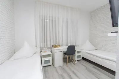 Ein Bett oder Betten in einem Zimmer der Unterkunft Hotel Billard Center Weywiesen