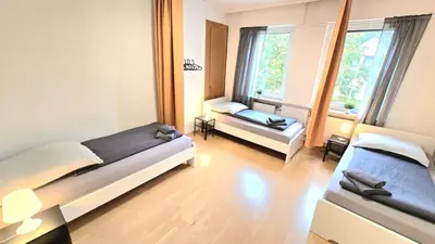 Ein Bett oder Betten in einem Zimmer der Unterkunft Modern 3-Room Apartment with Winter Garden, Free Parking in Hagen - HA01