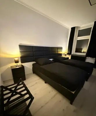 Ein Bett oder Betten in einem Zimmer der Unterkunft Freshly renovated City Apartments Essen KITCHEN WIFI near Düsseldorf Airport