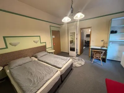 Ein Bett oder Betten in einem Zimmer der Unterkunft Apartments Starlight Hotel Wiesmann
