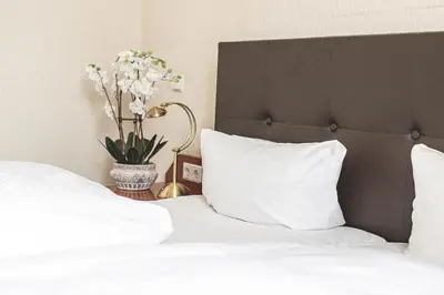 Ein Bett oder Betten in einem Zimmer der Unterkunft PLAZA INN Recklinghausen