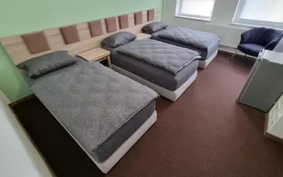 Ein Bett oder Betten in einem Zimmer der Unterkunft Hotel Linda