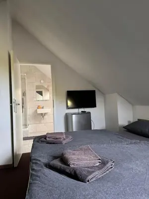 Ein Bett oder Betten in einem Zimmer der Unterkunft Hotel Linda