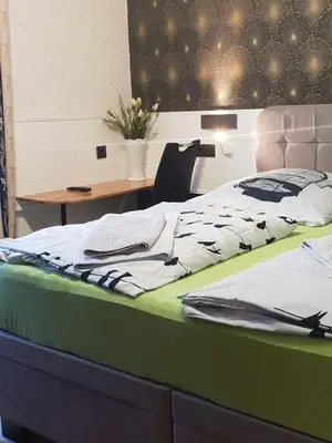 Ein Bett oder Betten in einem Zimmer der Unterkunft Waldhotel Lemberg