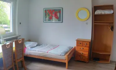 Ein Bett oder Betten in einem Zimmer der Unterkunft Uni-nähe Unterkunft mit Garten
