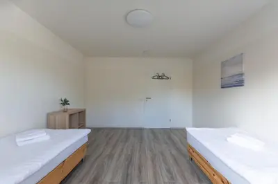 Ein Bett oder Betten in einem Zimmer der Unterkunft T&K Apartments - 3 Room Apartment with Balcony