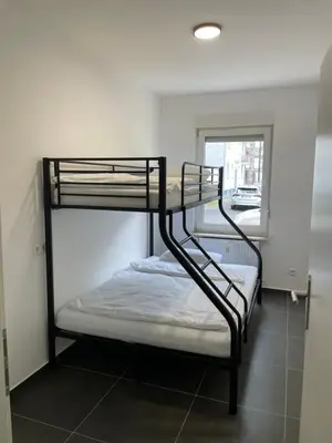 Ein Bett oder Betten in einem Zimmer der Unterkunft Apartment HomeBo