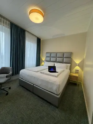 Ein Bett oder Betten in einem Zimmer der Unterkunft Hotel Königshof Dortmund