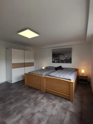 Ein Bett oder Betten in einem Zimmer der Unterkunft Moderne Wohnung mit Terrasse und eigenem Zugang.