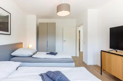 Ein Bett oder Betten in einem Zimmer der Unterkunft Glück Auf Appartements Schleiermacherstraße Duisburg