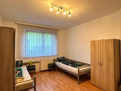 Ein Bett oder Betten in einem Zimmer der Unterkunft Duisburg FeelHome, Flughafen nah,3-Schlafzimmer, Dusche ebenerdig, Zentral, WiFi, Ground Floor