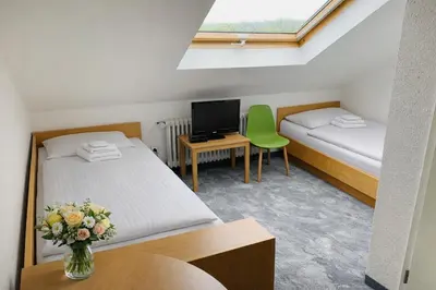 Ein Bett oder Betten in einem Zimmer der Unterkunft Silvio-Gesell-Tagungsstätte