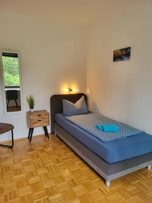 Ein Bett oder Betten in einem Zimmer der Unterkunft Messe Flughafen