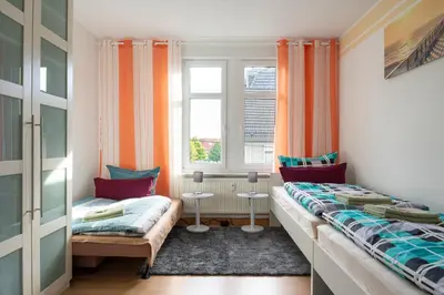 Ein Bett oder Betten in einem Zimmer der Unterkunft Ferienwohnung für 4, mitten in Solingen