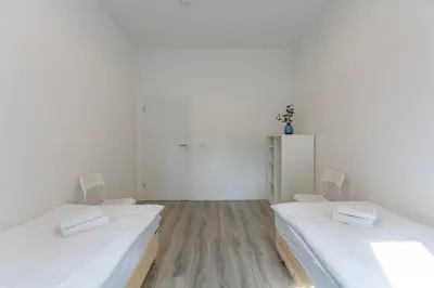 Ein Bett oder Betten in einem Zimmer der Unterkunft T&K Apartments - 1 to 4 Room Apartments - 20min to TradeFair Messe Airport Düsseldorf