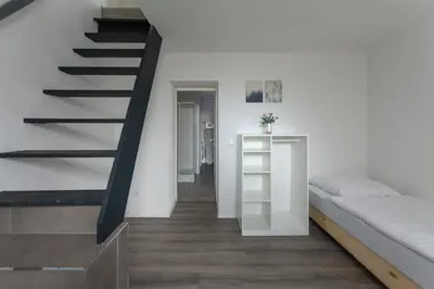 Ein Bett oder Betten in einem Zimmer der Unterkunft T&K Apartments - 1 to 4 Room Apartments - 20min to TradeFair Messe Airport Düsseldorf