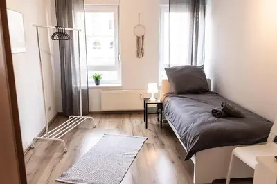 Ein Bett oder Betten in einem Zimmer der Unterkunft CosyHomes24 - centrally with balcony and parking space - IL01a