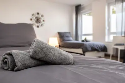 Ein Bett oder Betten in einem Zimmer der Unterkunft CosyHomes24 - centrally with balcony and parking space - IL01a