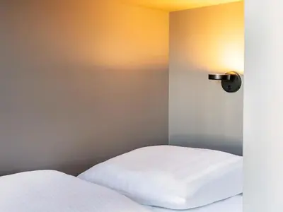 Ein Bett oder Betten in einem Zimmer der Unterkunft B&B Hotel Bochum-City