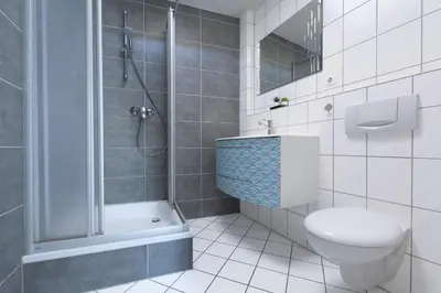 Ein Badezimmer in der Unterkunft T&K Apartments - 1-3 Zimmer Apartments - Essen