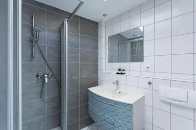 Ein Badezimmer in der Unterkunft T&K Apartments - 1-3 Zimmer Apartments - Essen