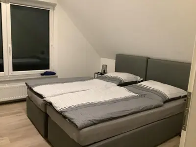 Ein Bett oder Betten in einem Zimmer der Unterkunft Ruhige Nachbarschaft