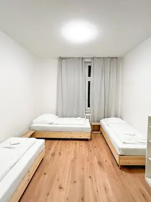 Ein Bett oder Betten in einem Zimmer der Unterkunft Tolstov Apartments - Several 1 Room Fitter Apartments with kitchen and washing machine - 25 Min Messe DUS