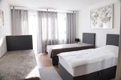 Ein Bett oder Betten in einem Zimmer der Unterkunft T&K Apartments near Messe Fair Trade Düsseldorf und Airport 1B