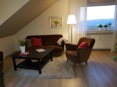 Ein Sitzbereich in der Unterkunft Haus Homann-Schneider, Apartment Stefan