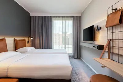Ein Bett oder Betten in einem Zimmer der Unterkunft Moxy Dortmund City