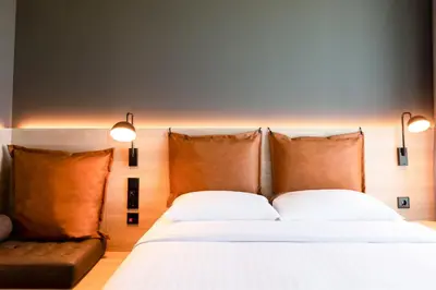 Ein Bett oder Betten in einem Zimmer der Unterkunft Moxy Dortmund City