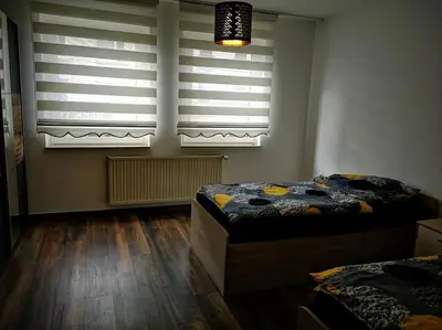 Ein Bett oder Betten in einem Zimmer der Unterkunft POLAT Apartments 3