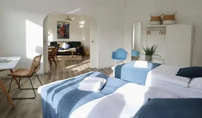 Ein Bett oder Betten in einem Zimmer der Unterkunft BOHO APARTMENT Essen - MESSE I KLINIKUM I BALKON