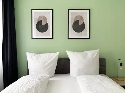 Ein Bett oder Betten in einem Zimmer der Unterkunft Apartments in the city center I home2share