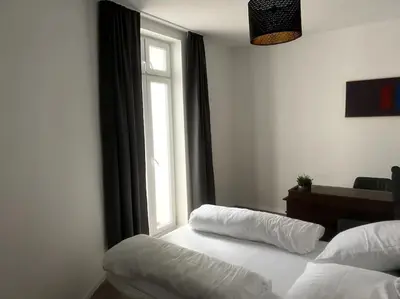 Ein Bett oder Betten in einem Zimmer der Unterkunft JayBnB - Geräumiges Apartment am Hafen von Dortmund